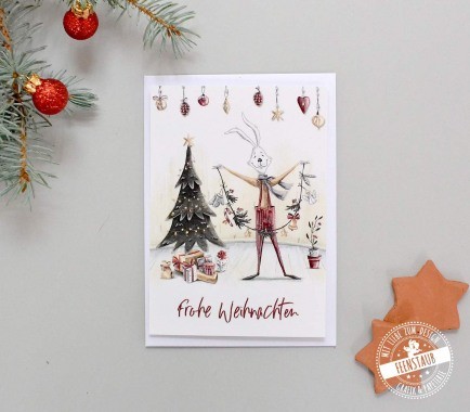 Weihnachtskarte zum Versenden guter Wünsche mit weihnachtlichen Hasenmotiven