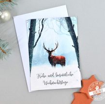 Weihnachtskarte mit Hirsch im Winterwald