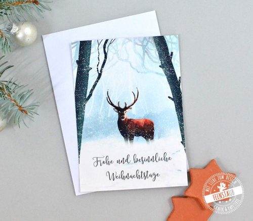 Weihnachtskarte mit Hirsch im Winterwald