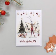Weihnachtskarte zum Versenden guter Wünsche mit weihnachtlichen Hasenmotiven